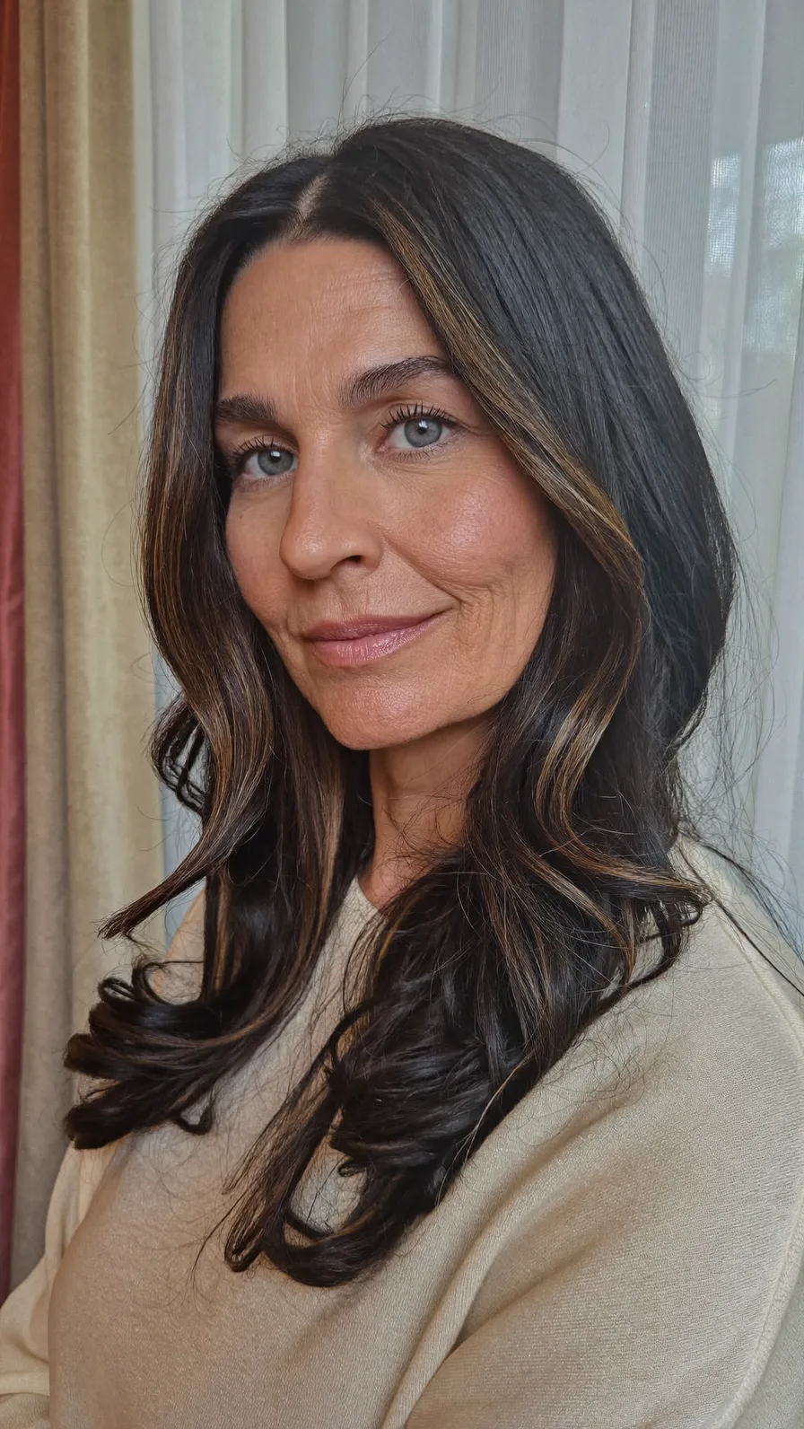 Elegant Long Layers with Subtle Caramel Balayage Highlights