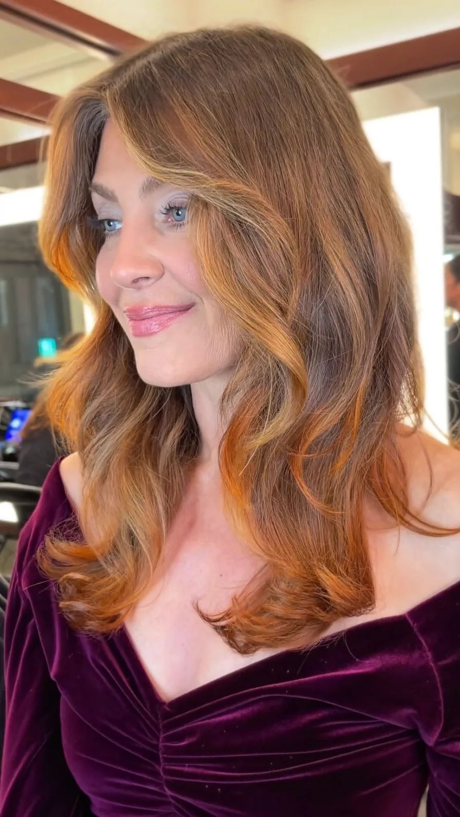 Soft Caramel Brown Layered Waves with Curtain Bangs