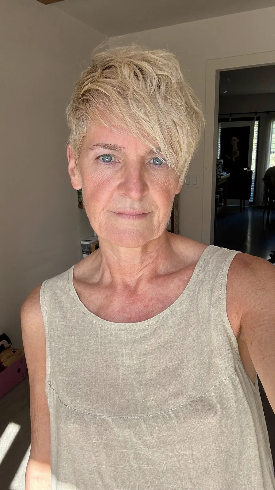 Choppy Textured Pixie with Side-Swept Platinum Blonde Bangs