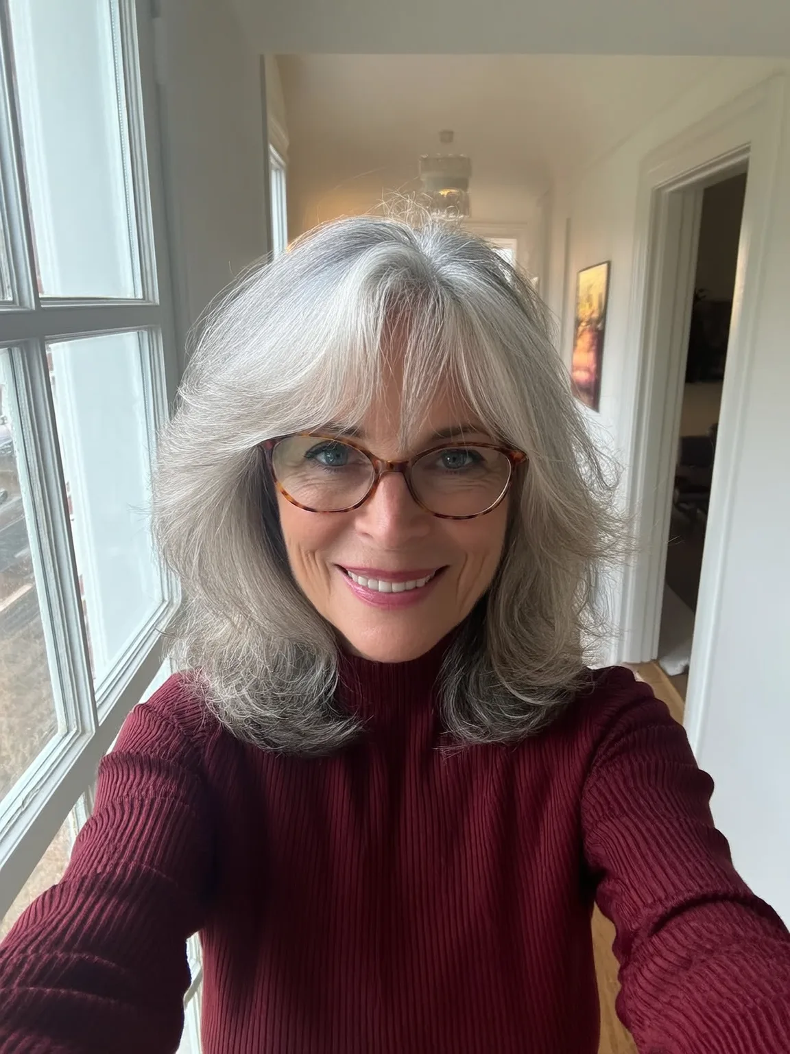 Shoulder-Length Silver Frost Layers with Curtain Bangs