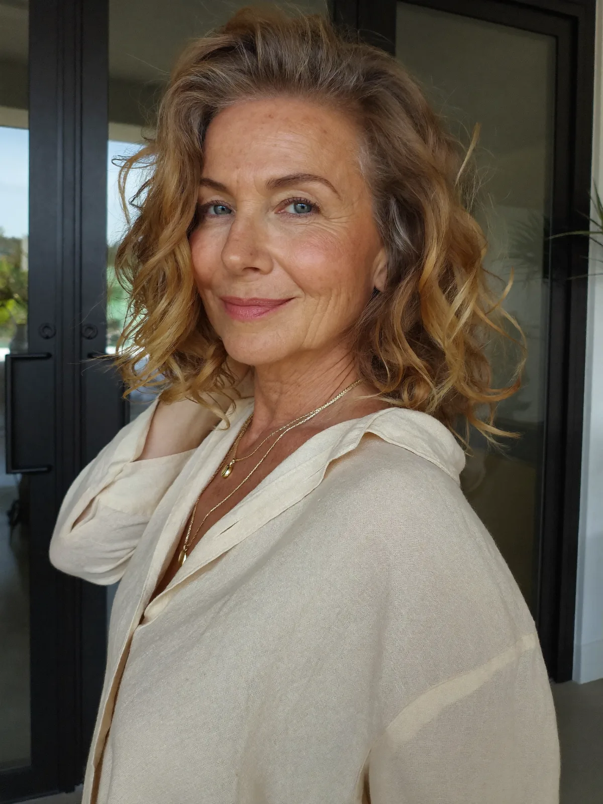 Soft Golden Blonde Waves with Voluminous Layered Texture for Mature Women