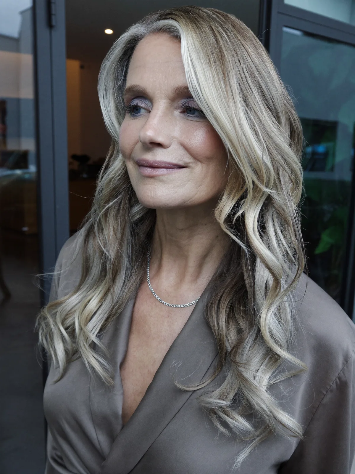 Silver Blonde Balayage Waves with Face-Framing Layers for Mature Women