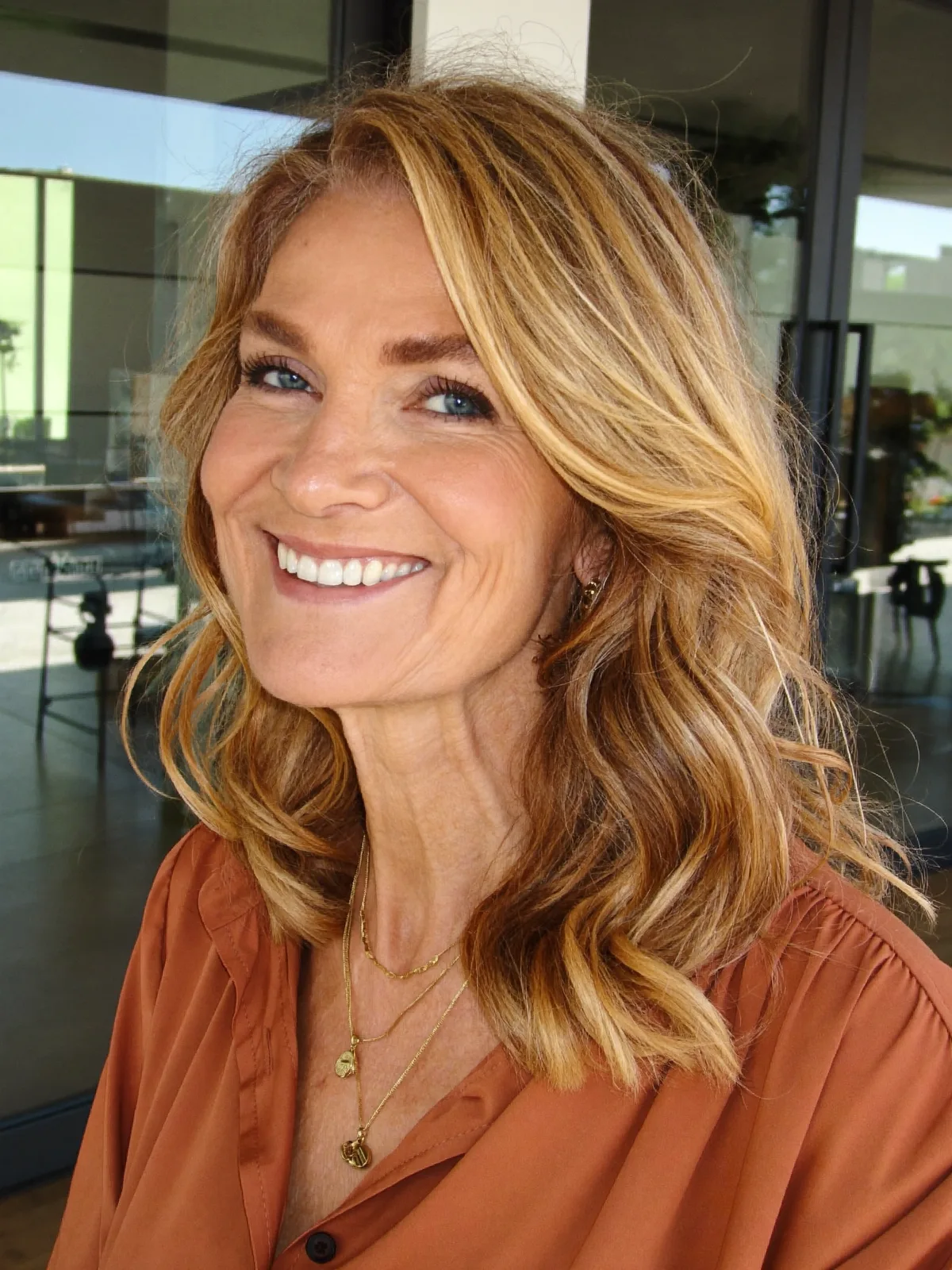 Golden Honey Balayage Waves with Soft Face-Framing Layers for Women Over 60