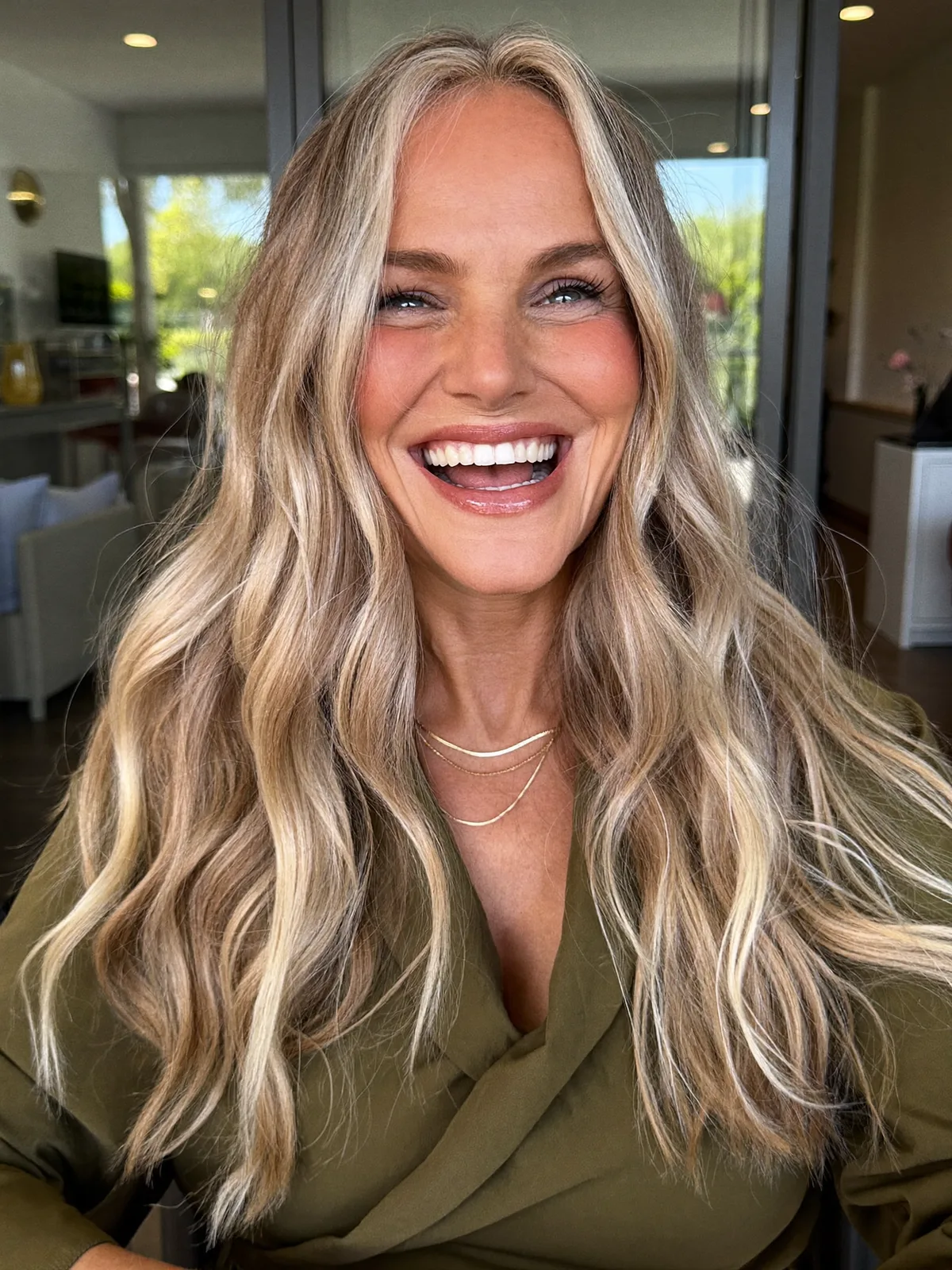 Sun-Kissed Ash Blonde Waves with Face-Framing Layers for Women Over 60
