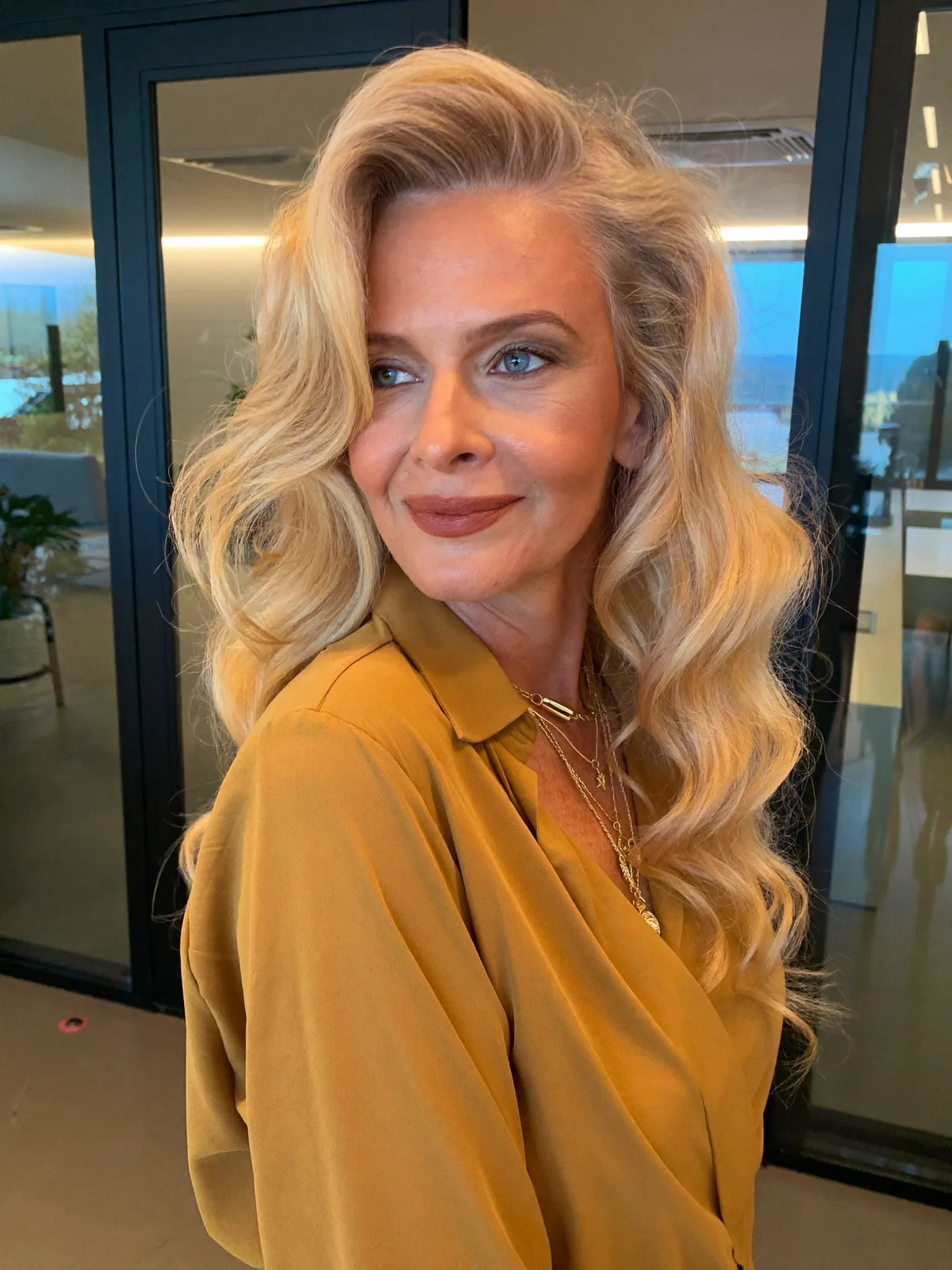 Soft Voluminous Ash Blonde Waves with Side-Swept Lift for Mature Elegance