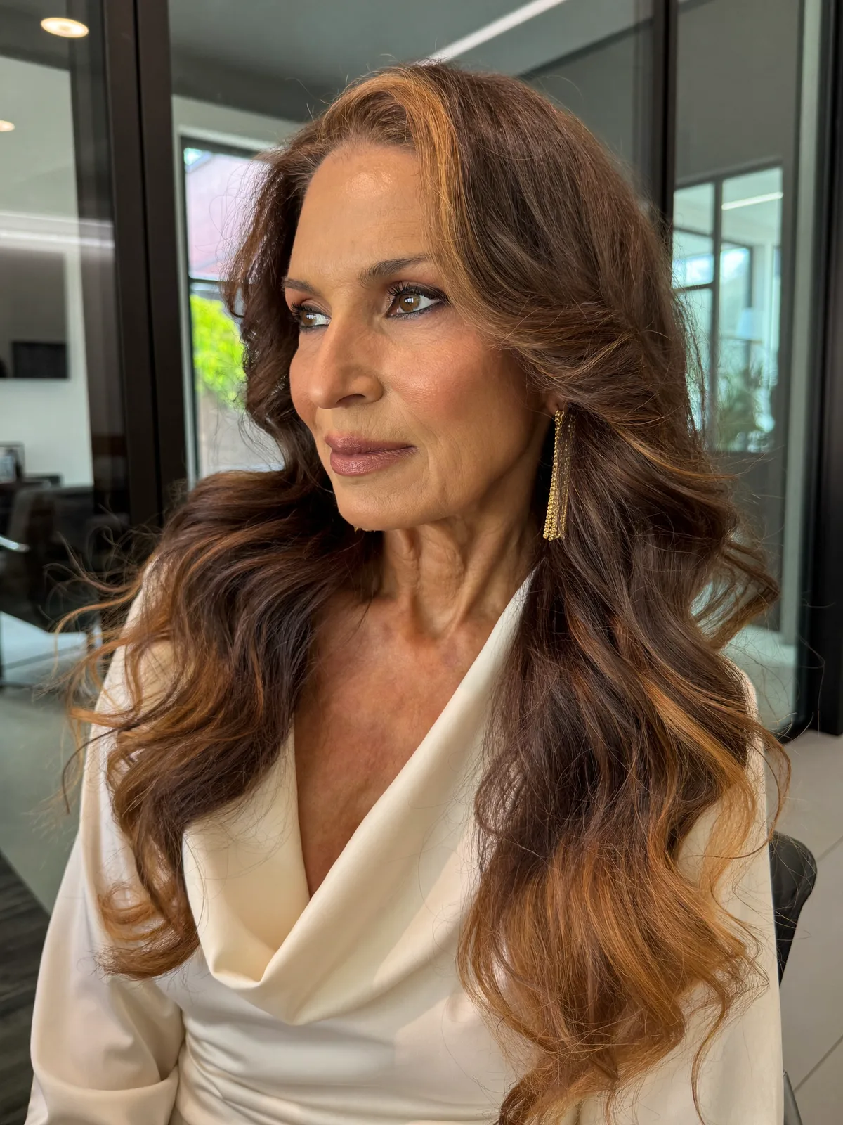Warm Brunette Balayage Waves with Soft Face-Framing Layers for Mature Women