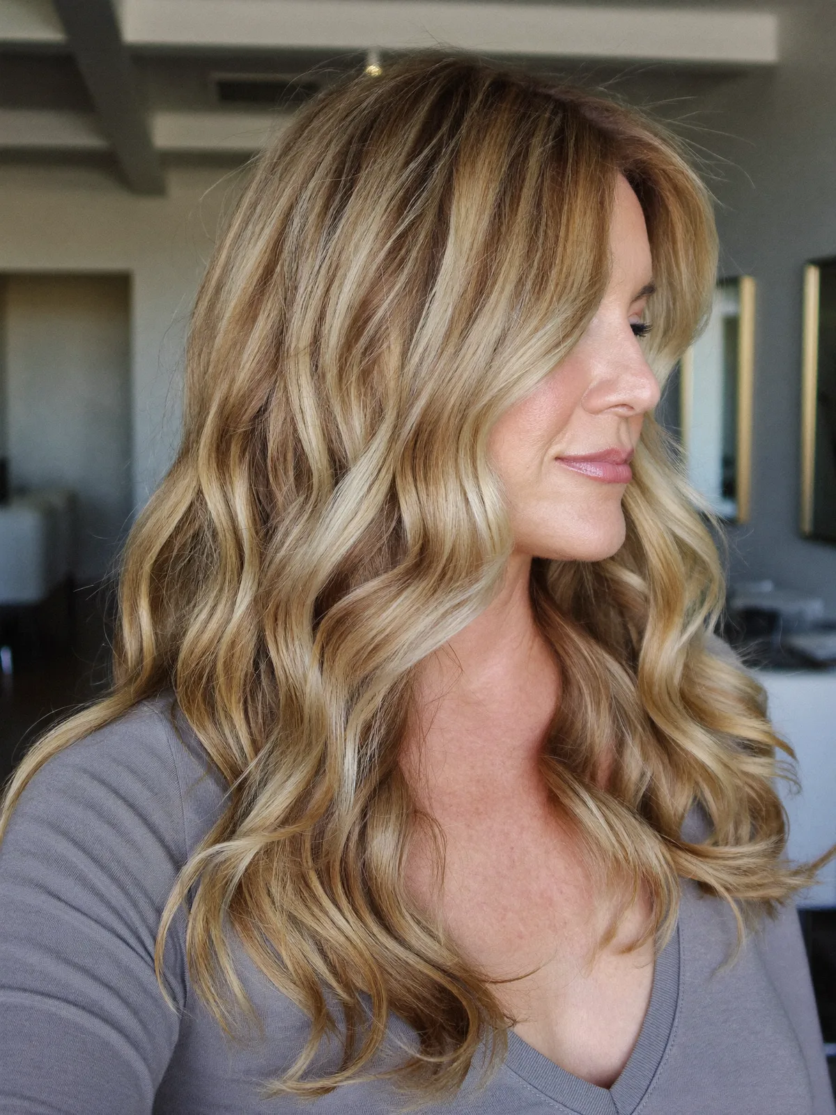 Soft Honey Blonde Waves with Youthful Face-Framing Layers