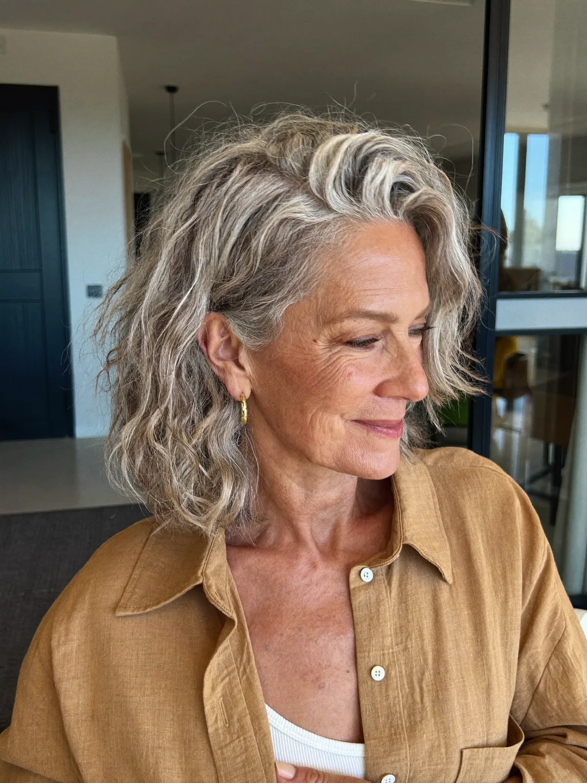 Textured Silver Waves with Voluminous Side Part for Mature Hair