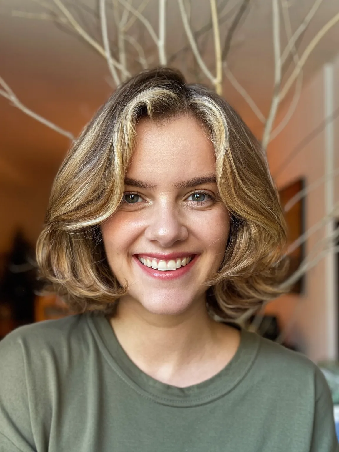 Voluminous Sandy Blonde Short Bob with Side-Swept Bangs