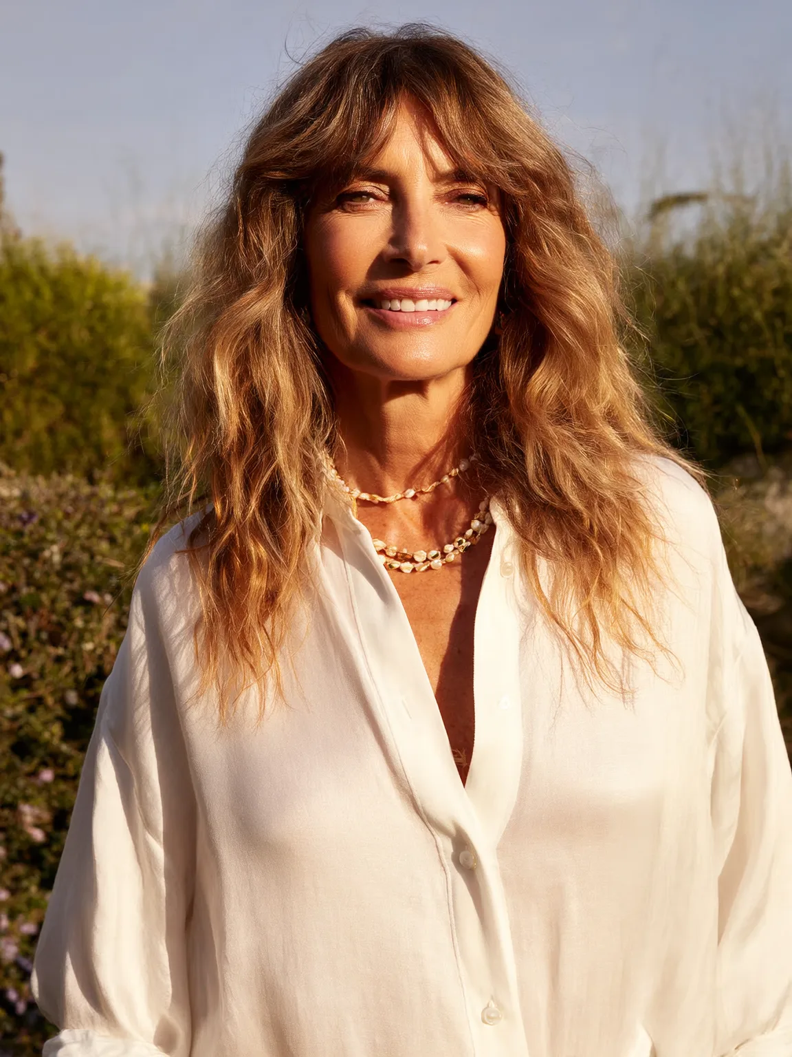 Voluminous Golden Sandy Blonde Shag with Curtain Bangs