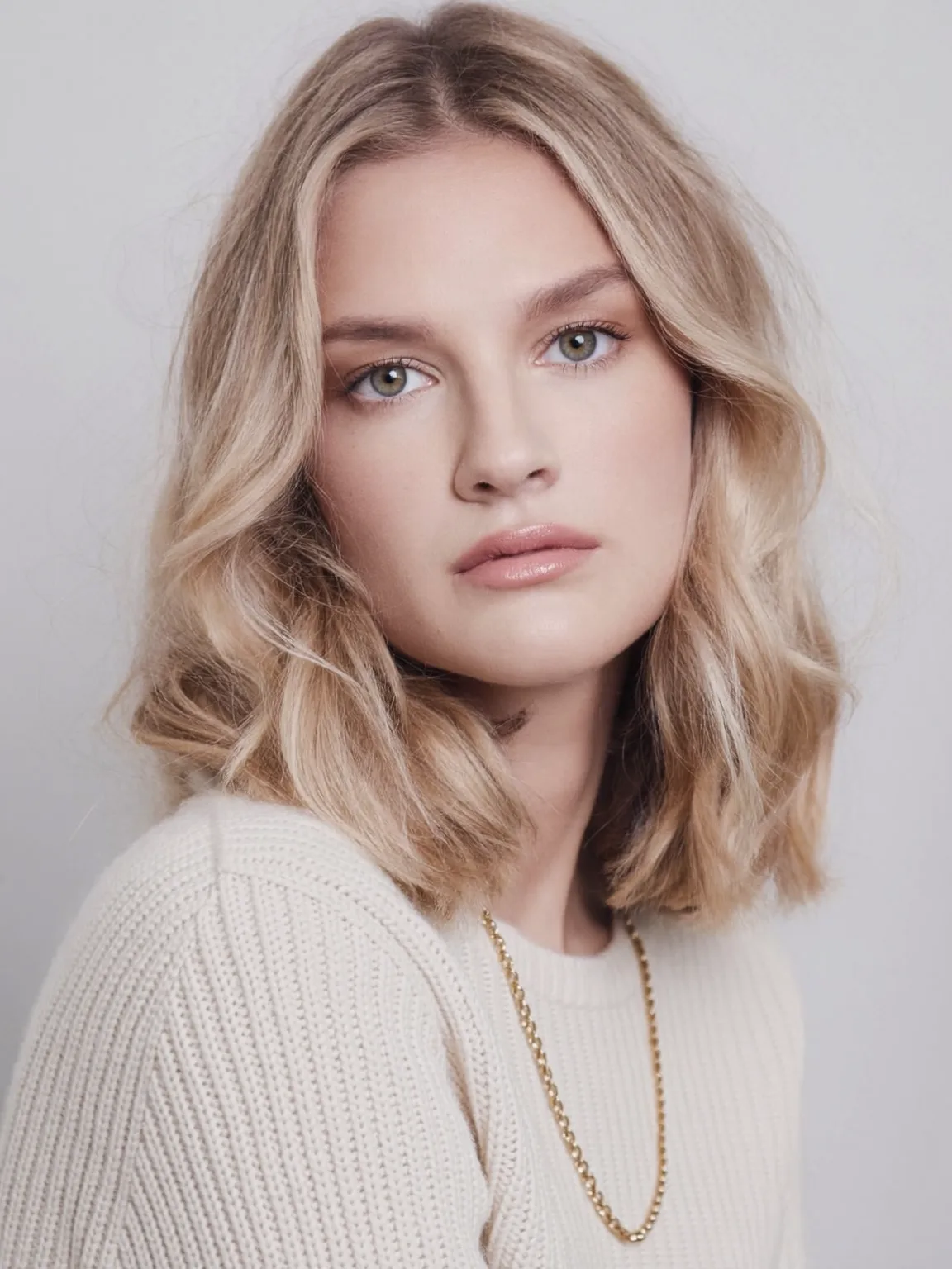Medium-Length Sandy Blonde Wavy Lob