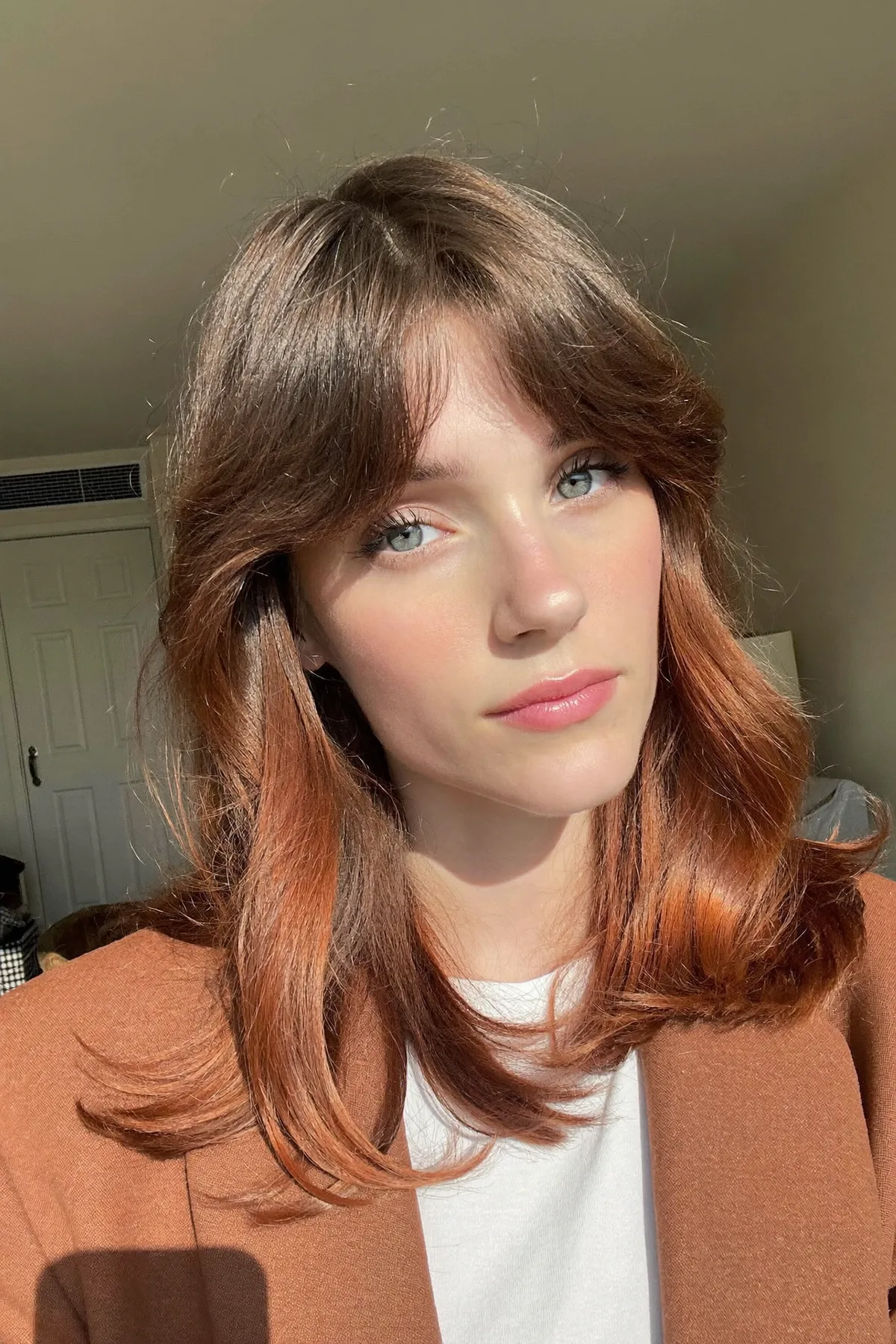 Radiant Strawberry Blonde Wavy Lob with Curtain Bangs Perfection