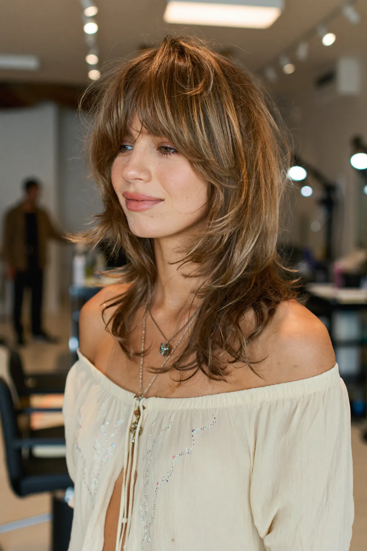 Wavy Dark Blonde Collarbone-Length Lob with Curtain Bangs