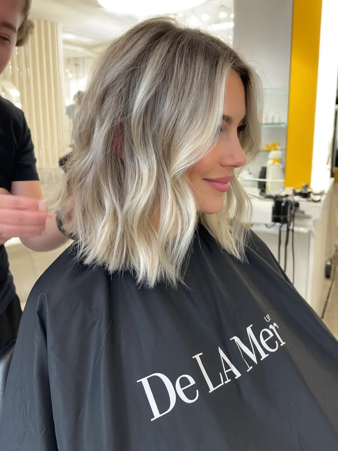 Golden Honey Balayage Lob with Curtain Bangs and Volume