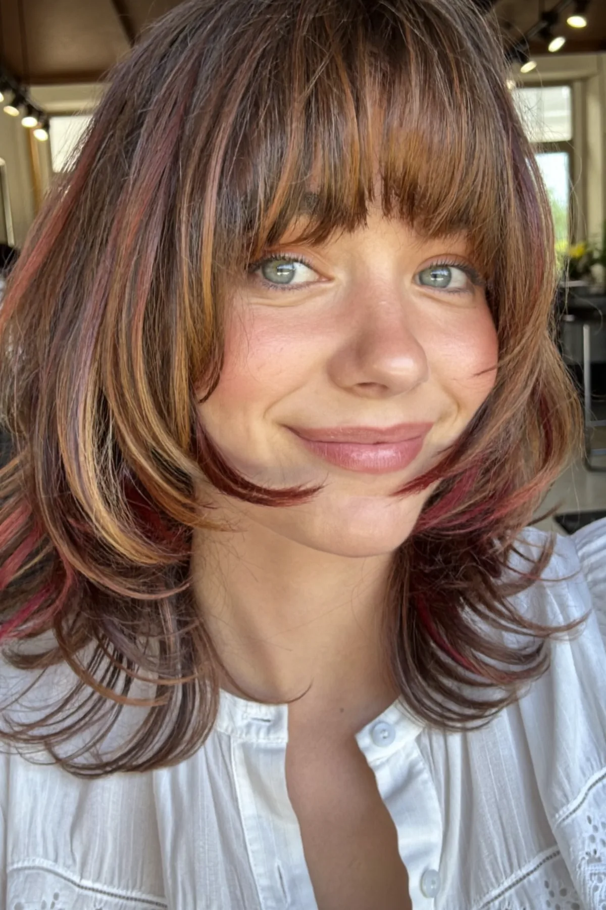Caramel Bronde Balayage Lob with Full Fringe and Chunky Highlights