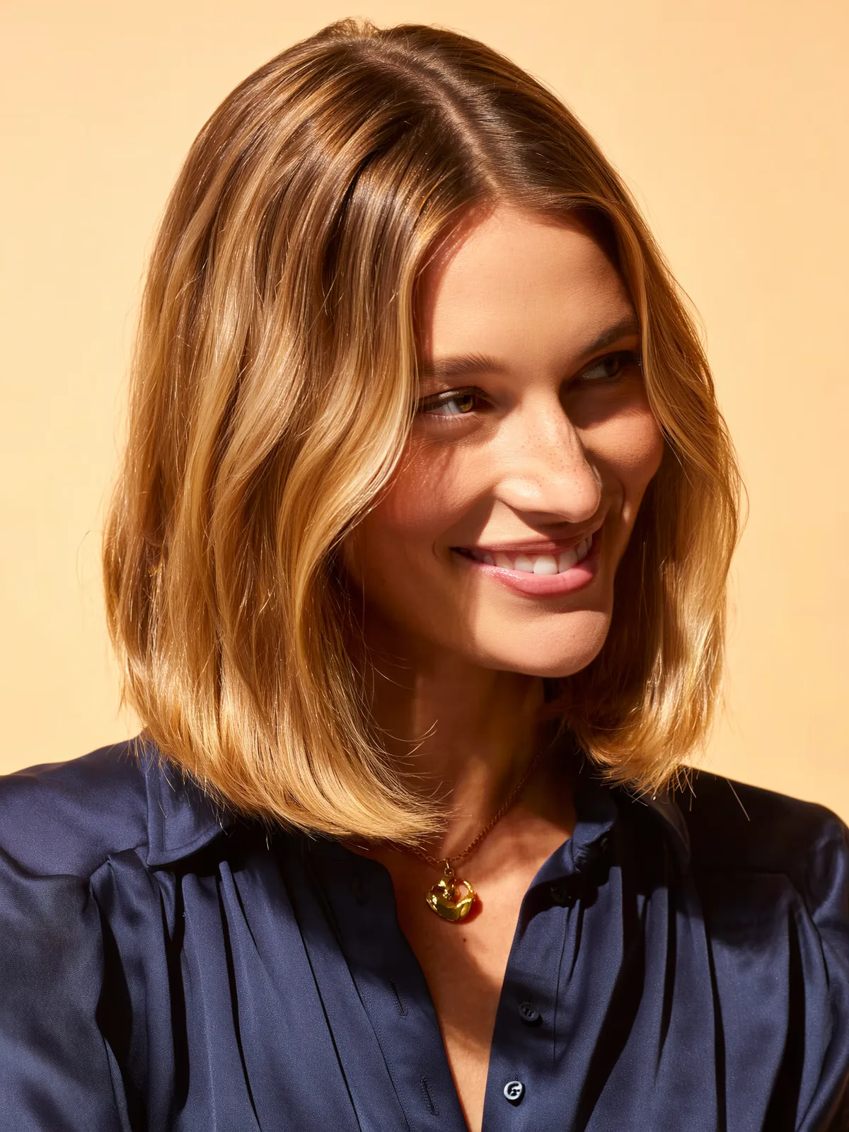 Voluminous Soft Sandy Blonde Lob with Curtain Bangs