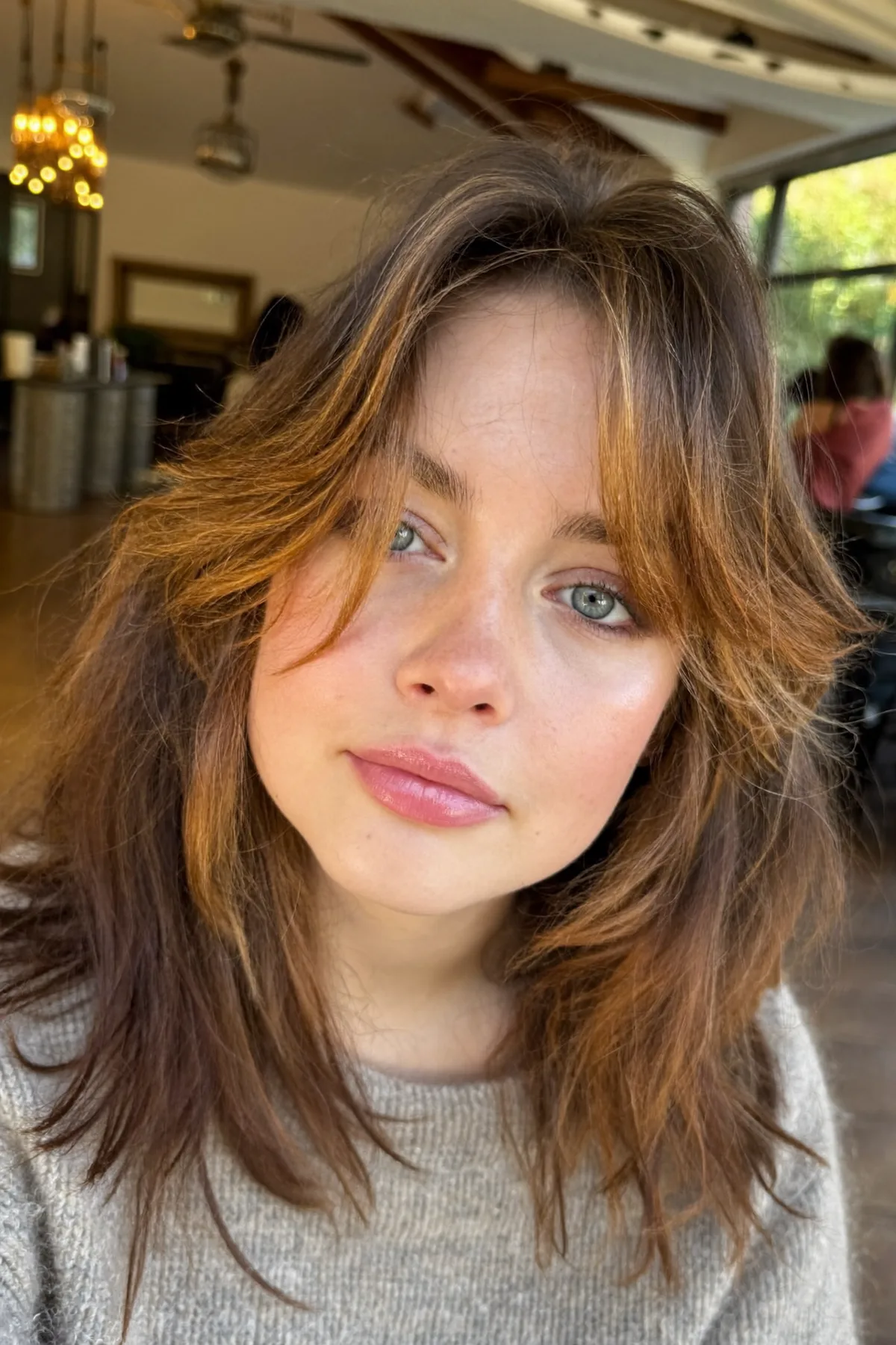 Caramel Bronde Balayage Lob with Wavy Texture and Curtain Bangs