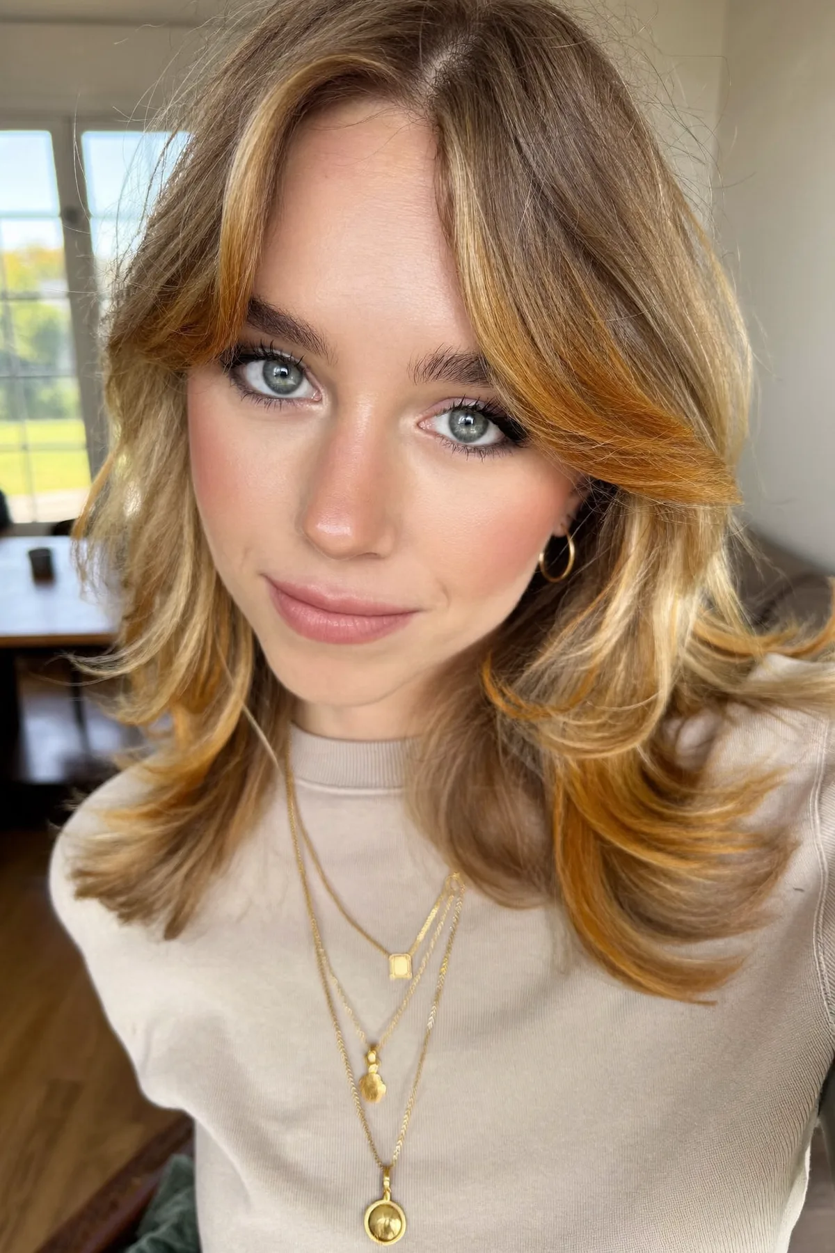 Honey Golden Blonde Wavy Lob with Curtain Bangs and Money-Piece Highlights