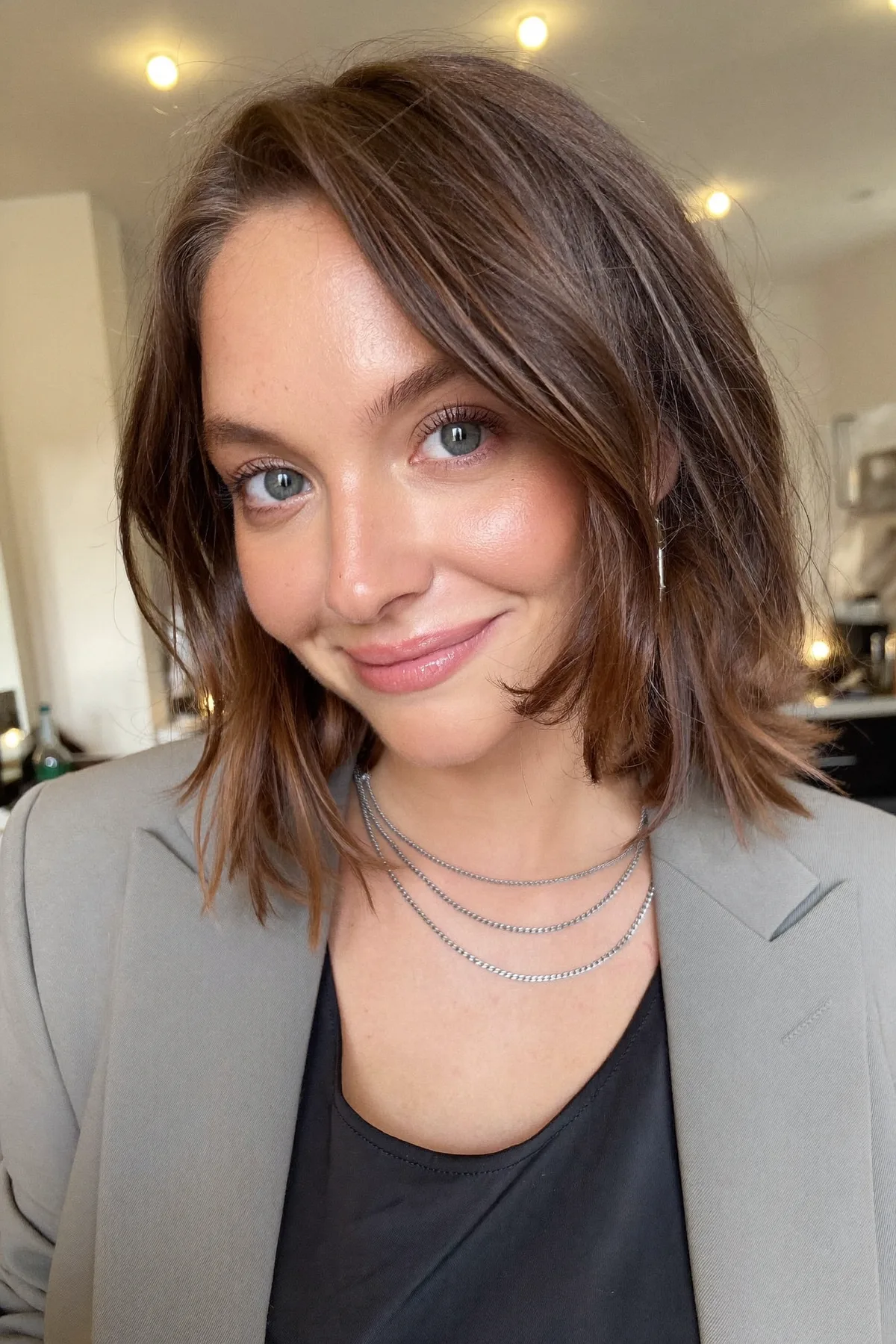 Effortless Natural Brunette Wavy Lob with Curtain Bangs