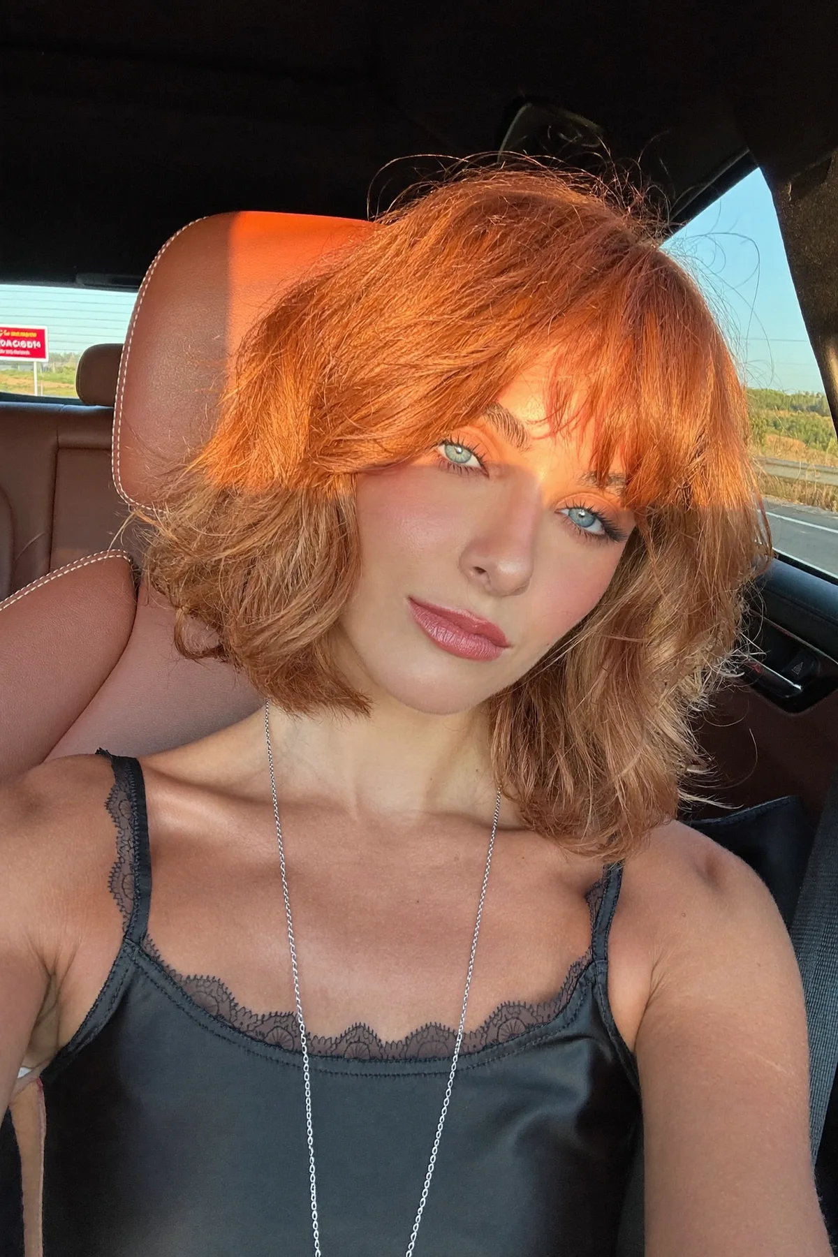 Wavy Strawberry Blonde Long Bob with Full Fringe Bangs