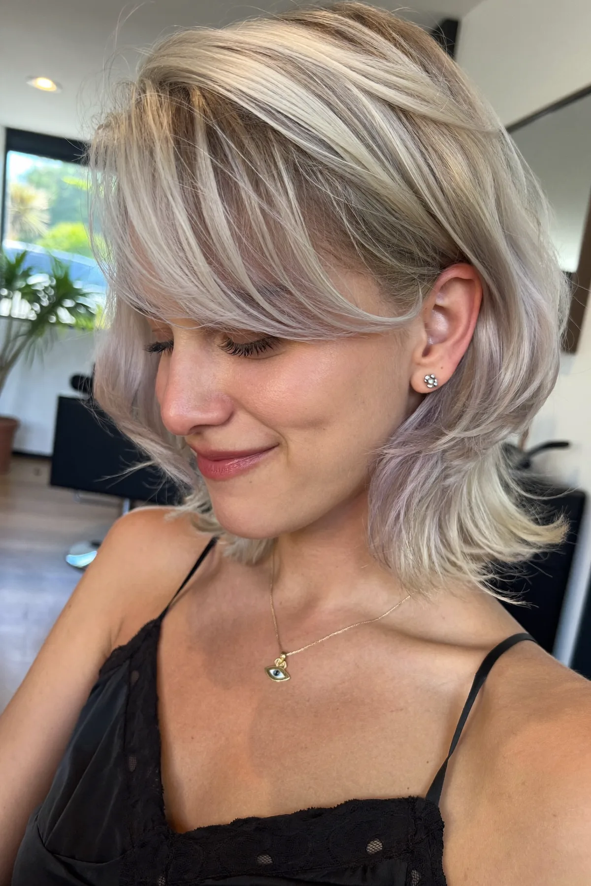 Platinum Ash Blonde Shoulder-Length Lob with Curtain Bangs