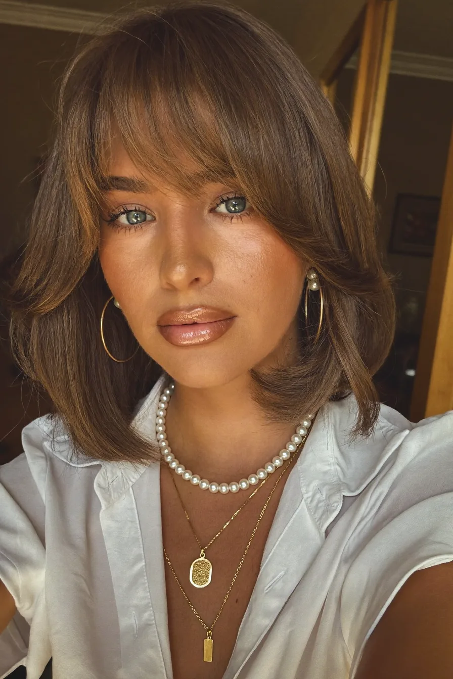 Chic Shoulder-Length Bob with Soft Wispy Bangs