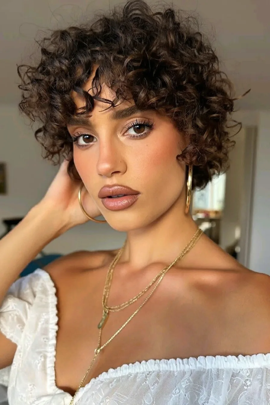 Chic Curly Bob with Face-Framing Wispy Bangs for Volume