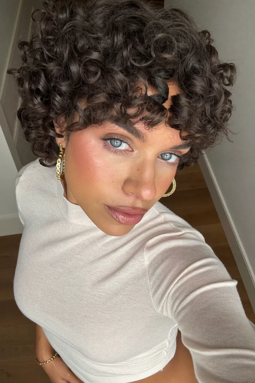 Short Curly Bob with Voluminous Wispy Bangs for Bold Impact