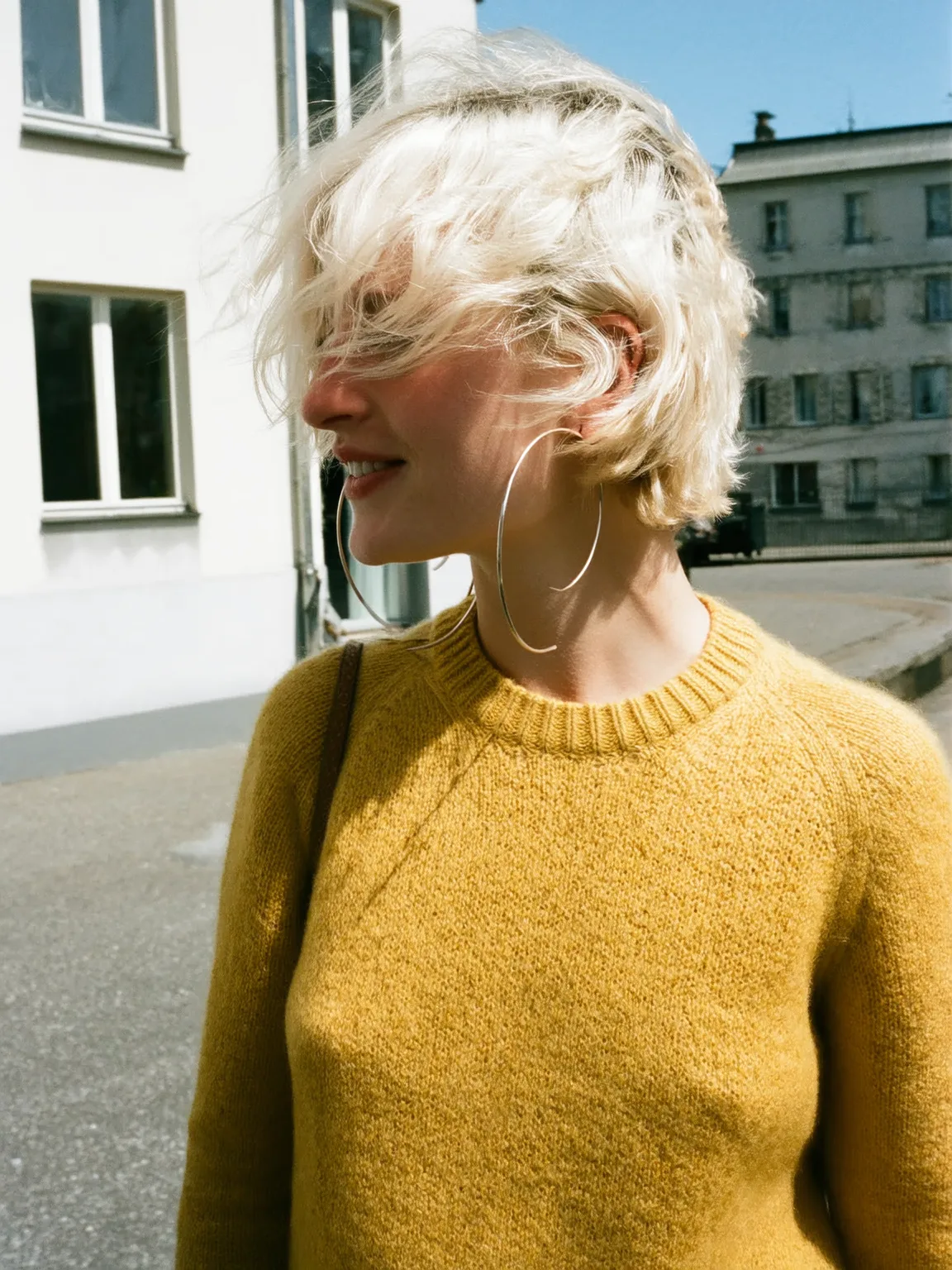 Wavy Platinum Blonde Pixie with Wispy Fringes