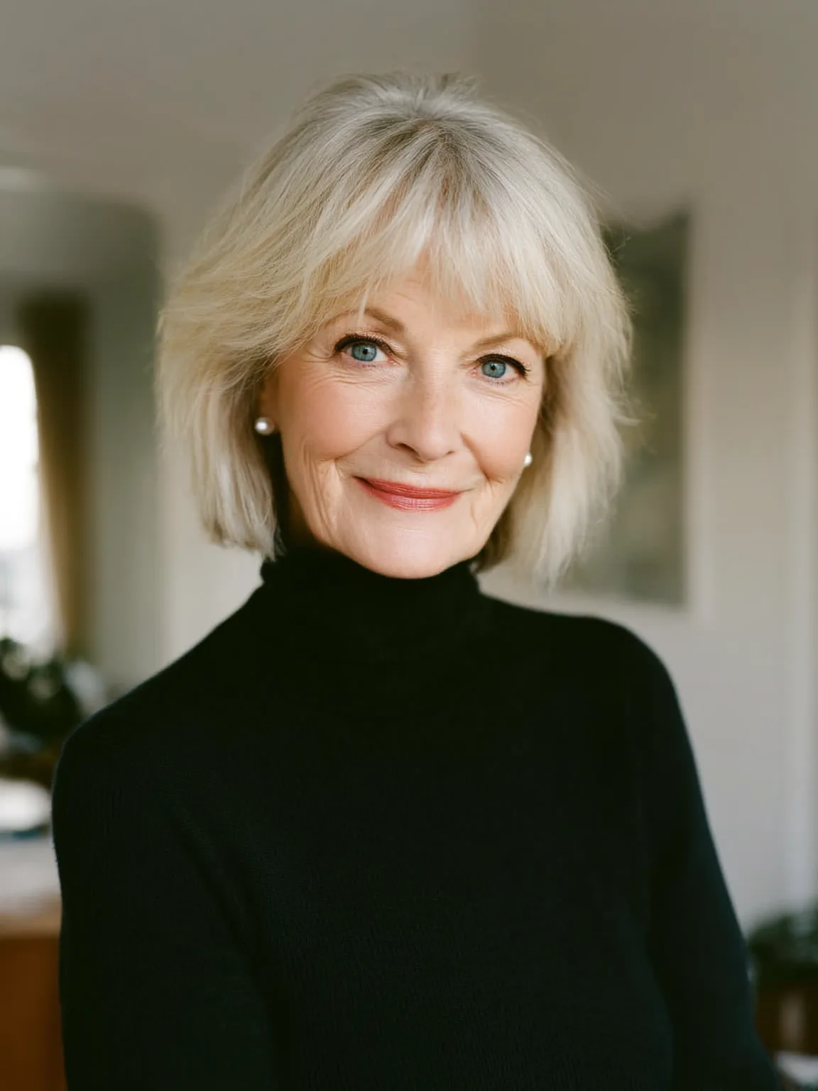 Sleek Straight Platinum Blonde Bob with Wispy Bangs