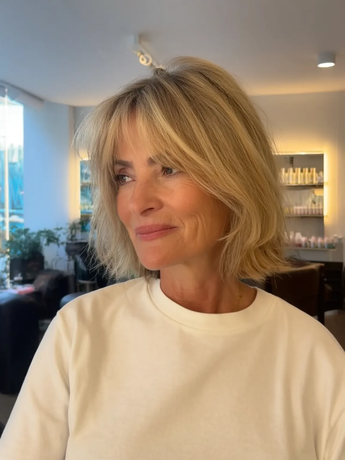 Medium Volume Sandy Blonde Wavy Bob with Wispy Bangs